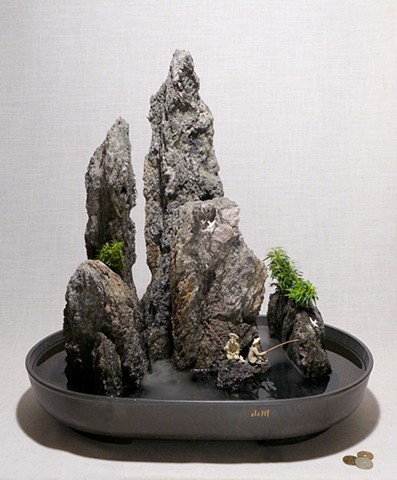 feather rock fountain with live plants, waterfall, fogger, and miniature figurines