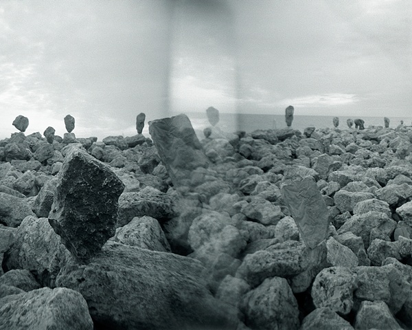 Holga camera image of rock balancing along Lake Michigan by lucy mueller