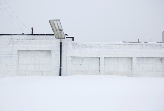 After a big snow storm a white gas station blends in photographed by Lucy Mueller
