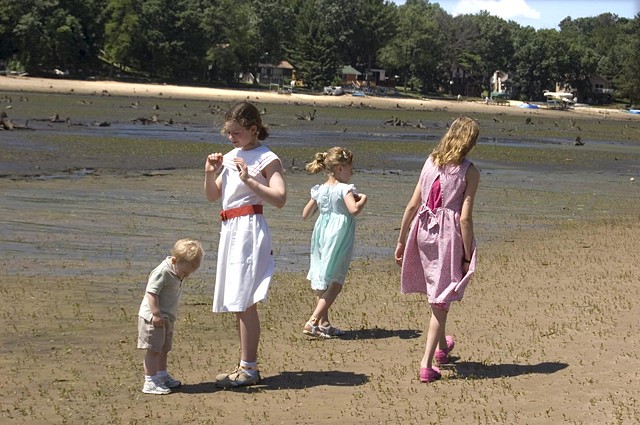 Children in their Sunday best stand in what was once Lake Delton in Wisconsin after the lake drained photographed by lucy mueller