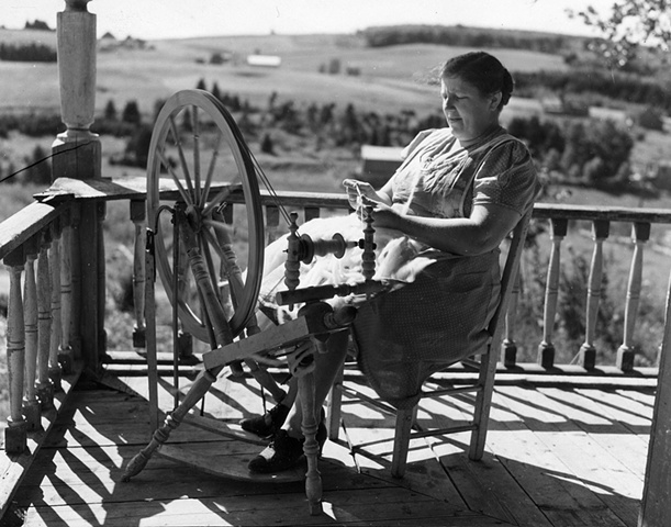 Wife of Albert Gagnon, Acadian FSA client, spinning domestic wool for knitting,  Fort Kent, MO