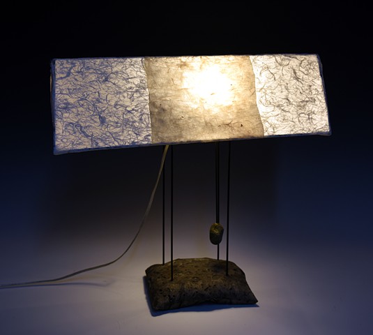 table lamp concrete base painted steel structure hand papered shade  white off white beige  soft light