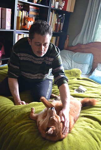 David Petting Rocky on Bed No. 2