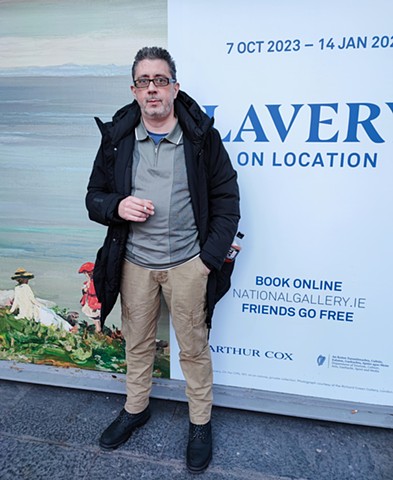 David in Front of Advert for Lavery on Location