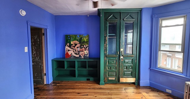 Custom wardrobe and shelves with salvaged doors