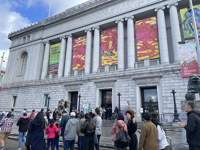 Audience going into the exhibition