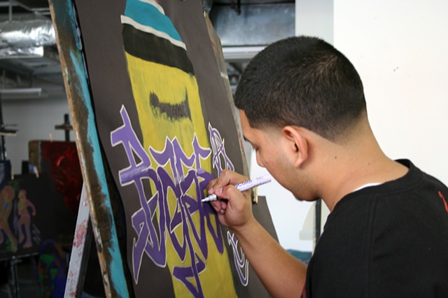Alan adding some paint marker touches to his piece