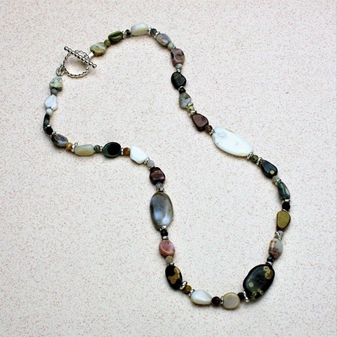 delicate choker of multi-hued tumbled ocean jasper pebbles highlighted by faceted  ocean jasper & silver spacer beads; sterling toggle clasp (#803)