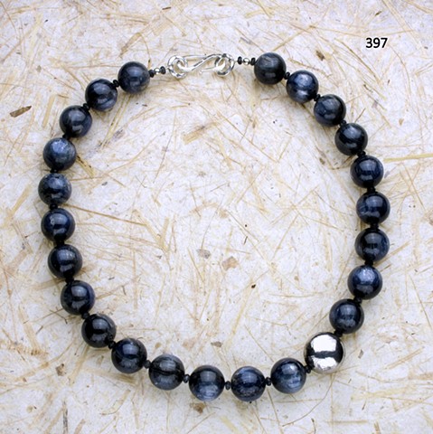 exceptional blue kyanite with handcrafted silver accent bead and faceted iolite, finished with silver clasp ((#397)