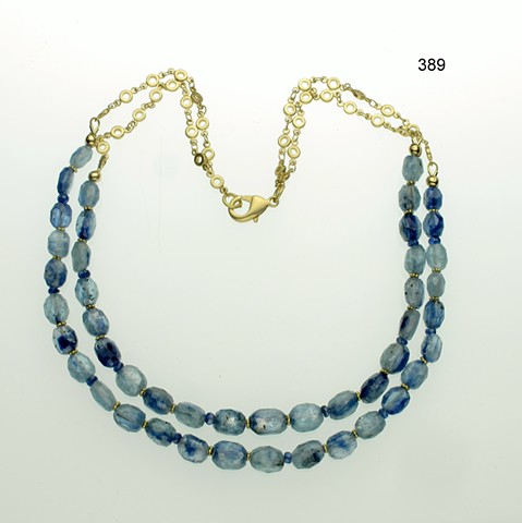 spectacular double strand of faceted blue kyanite accented with vermeil Bali spacers, g/p brass chain & clasp
(#389)