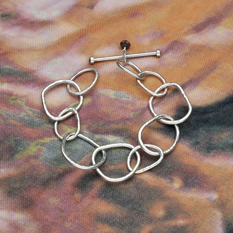 hammered heavy silver link bracelet with bezel set garnet toggle bar, 8" but can be worn smaller (#530B)