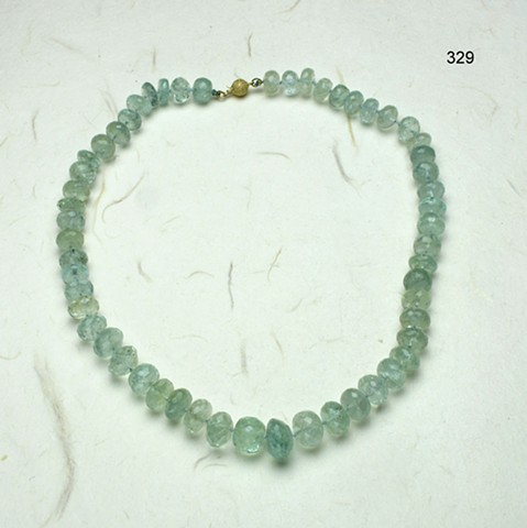 exquisite faceted aquamarine rondelles knotted on silk and finished with a 14kt gold clasp