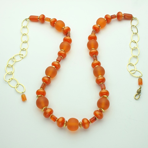 "brilliantly orange"  vintage moonglow lucite, carnelian, orange lucite, vermeil beads, g/f  chain
(#408)