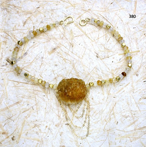 natural crystallized citrine focal stone strung w/ faceted rutilated quartz and vermeil beads, accented with dangling g/f chain; finished with a vermeil clasp (#380)