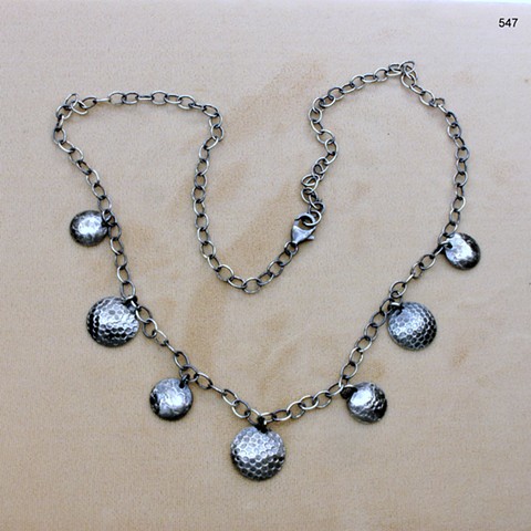 oxidized textured domed discs hang from an oxidized sterling chain, sterling lobster clasp (#547)