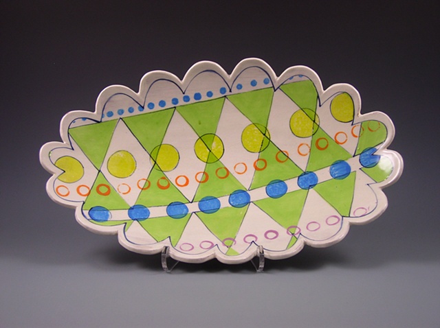 hand-built oval platter with slip and underglaze decoration
