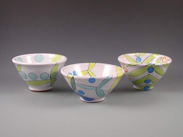 small thrown earthenware bowls or custard cups with majolica glaze 