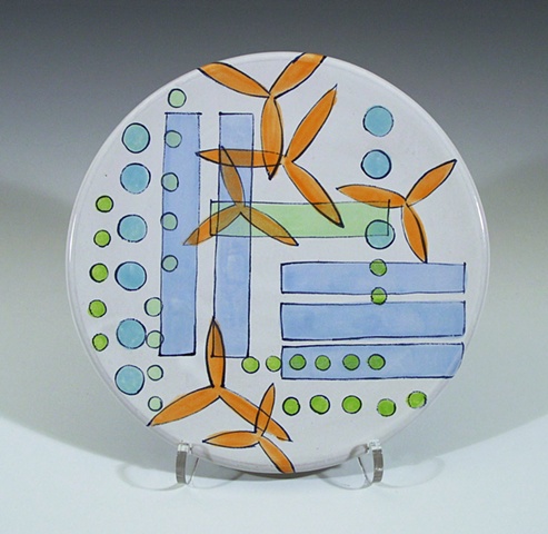 small thrown plate with hand-painted majolica glaze