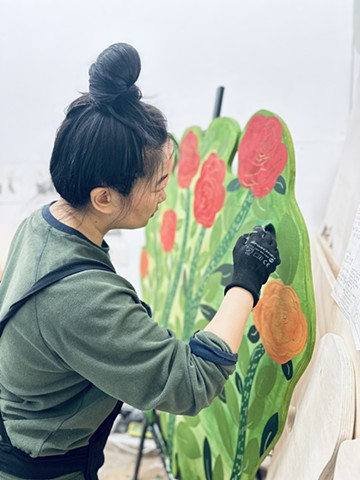 Jinzhe is Painting the Innovative Flower in Her Studio