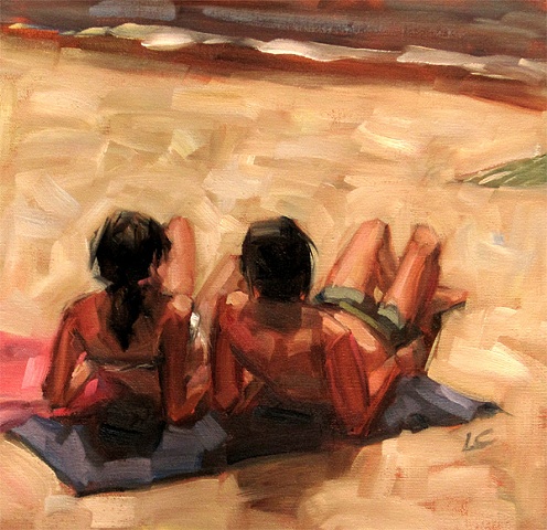 Man and woman sunbathing on beach