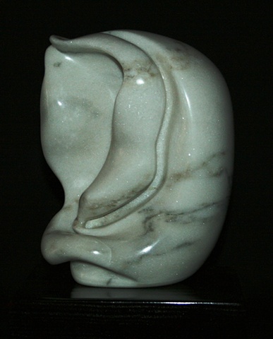 This is a comtemporary stone sculpture of a biomorphic organic form by Denis A. Yanashot.