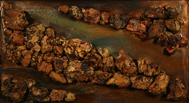 Mixed Media Relief (birch plywood, burnt anthracite culm clumps, adhesive, epoxy resin, mica powders, acrylic paint)Nonobjective piece resembling the colors of copperheads. 