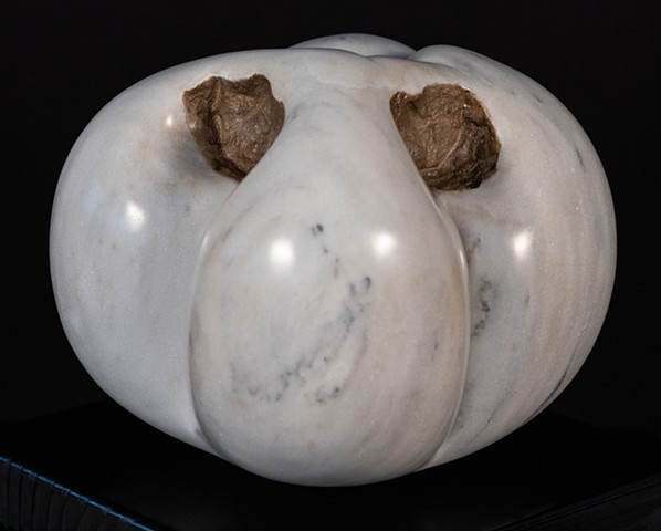 This is a sculpture of a “catfaced” tomato.