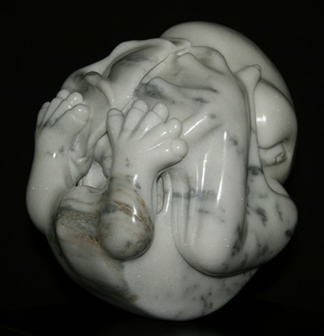This is a comtemporary stone sculpture of a black mastiff bat embryo by Denis A. Yanashot.