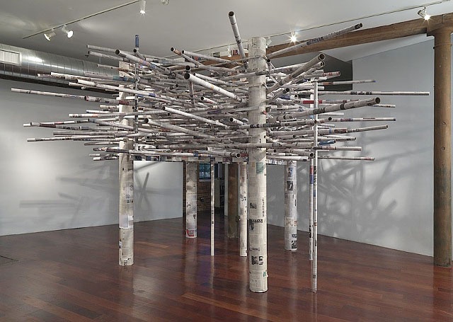 A large site speciic sculpture made of newspaper and cardboard that the viewer can enter.