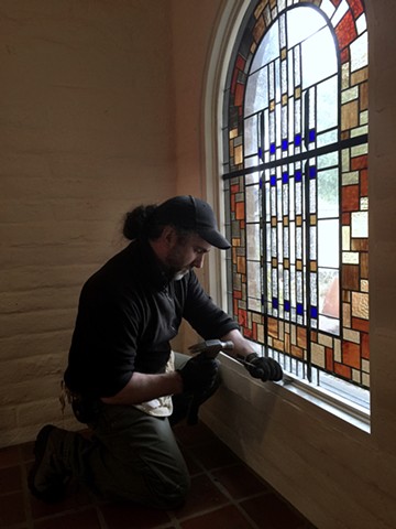 working on a window by Arthur Stern, Architectural Glass artist.