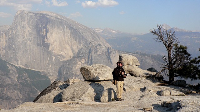 sketching on top of North Dome, 
Half Dome visible across the valley
Yosemite National Park CA