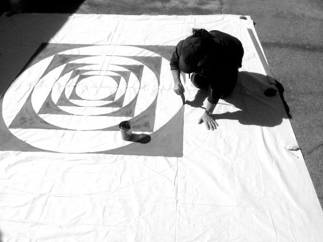 painting a mandala floor painting for Esalen Workshops