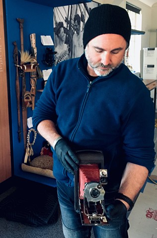 holding novelist Jack London's camera. London made thousands of negatives with this camera all over the world.
Lead mount-maker for the exhibit renewal at Jack London Museum, Glen Ellen CA 
(w/ Gizmo Inc.)
