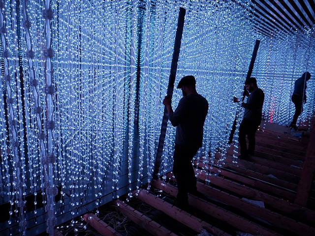 exhibit installer on the exhibit 'Crystal Universe' by Tokyo-based art collective TEAMLAB, 
Pace Art + Technology, Palo Alto CA
(c/o Gizmo Inc) (photo by Po Bym)
