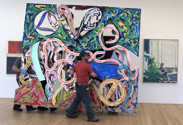 Lead Installer for the Anderson collection of American Art, Stanford University, Palo alto CA (photo C/o SFChronicle). Here installing a large work by Frank Stella 