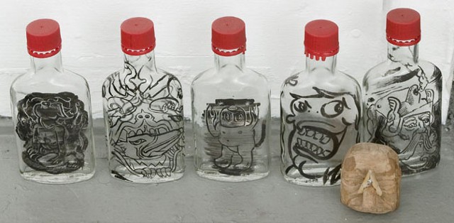 idiosyncratic pre-anthropocene social anxiety in sumi ink on vodka bottles 