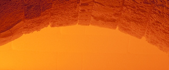 Enlarged closeup of the hot interior space of a glass melting furnace.