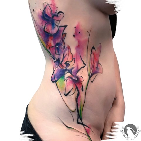 Abstract watercolor flowers tattoo