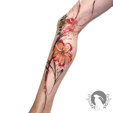 Abstract watercolor flower tattoo