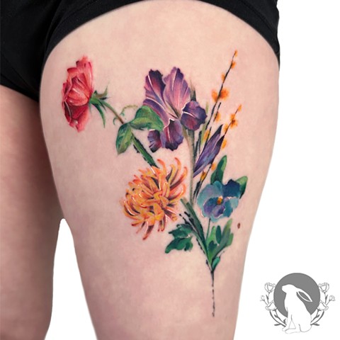 Watercolor flower composition tattoo