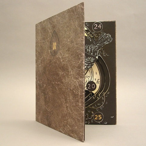 Artist Book by Carrie Ann Plank. Carousel book with Relief, Pochoir stencils, and Gold leafing.  Printed in an edition of 2.