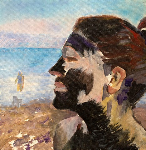 Self-portrait at the Dead Sea with my face covered in mud, evoking a tribal mask
