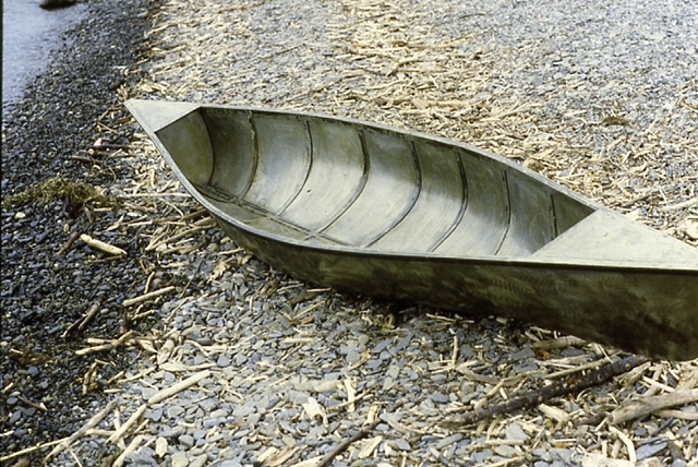 %Steel Canoe% displayed on a beach