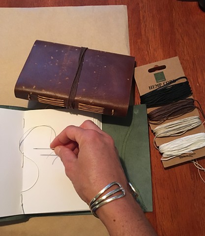 Stitching a leather journal 