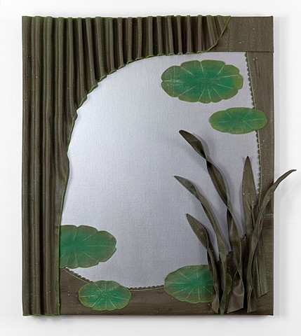 three-dimensional painting with brown canvas decorative frame around silver surface that looks like a mirror. The brown canvas is rippled at the top like a theater curtain, with long grasses at the bottom right corner. There are green lily pads surroundin