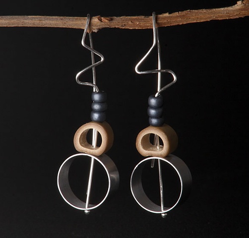 Sculptural mixed-material earrings with movement!