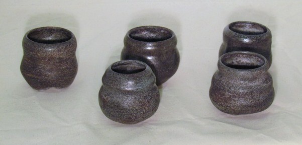 Five small dark vessels
