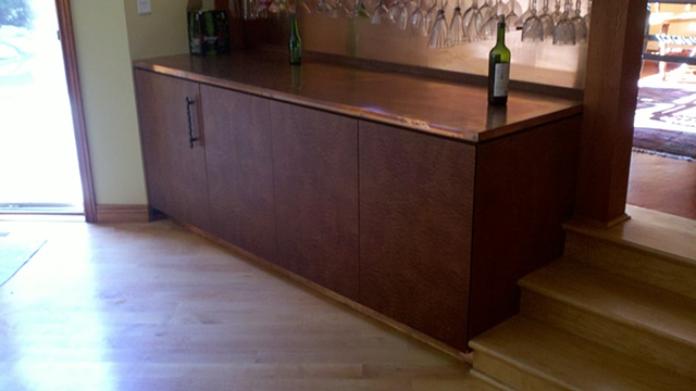 exotic sapele dry bar with copper counter