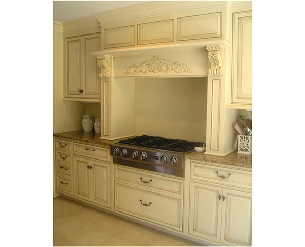 Hood and Cabinetry in white classical style kitchen.