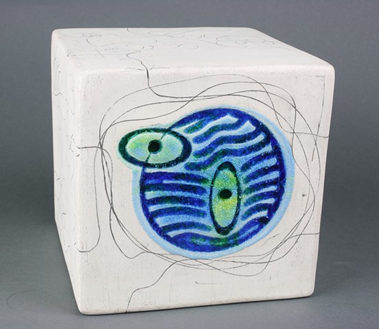 Handmade white earthenware cube with fused glass and rusted iron